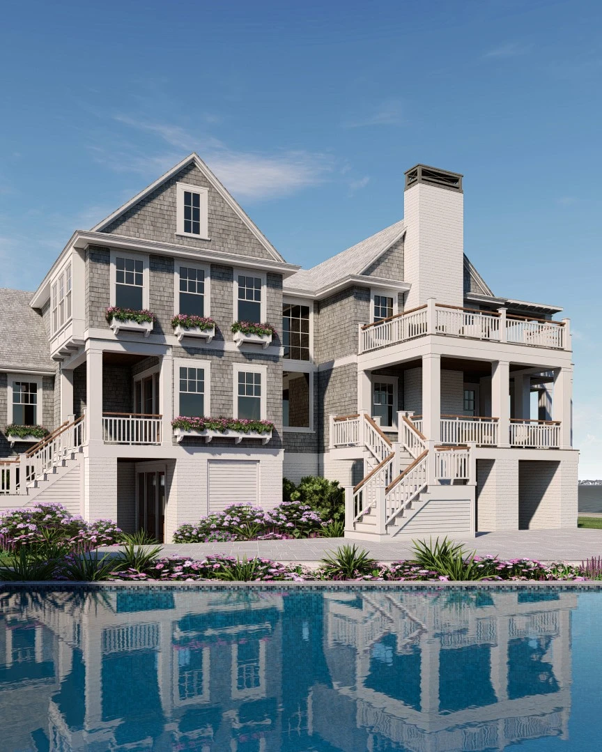 Waterfront residence with shingle and clapboard facade, multiple decks, and pitched roof with prominent chimney reflected in pool.