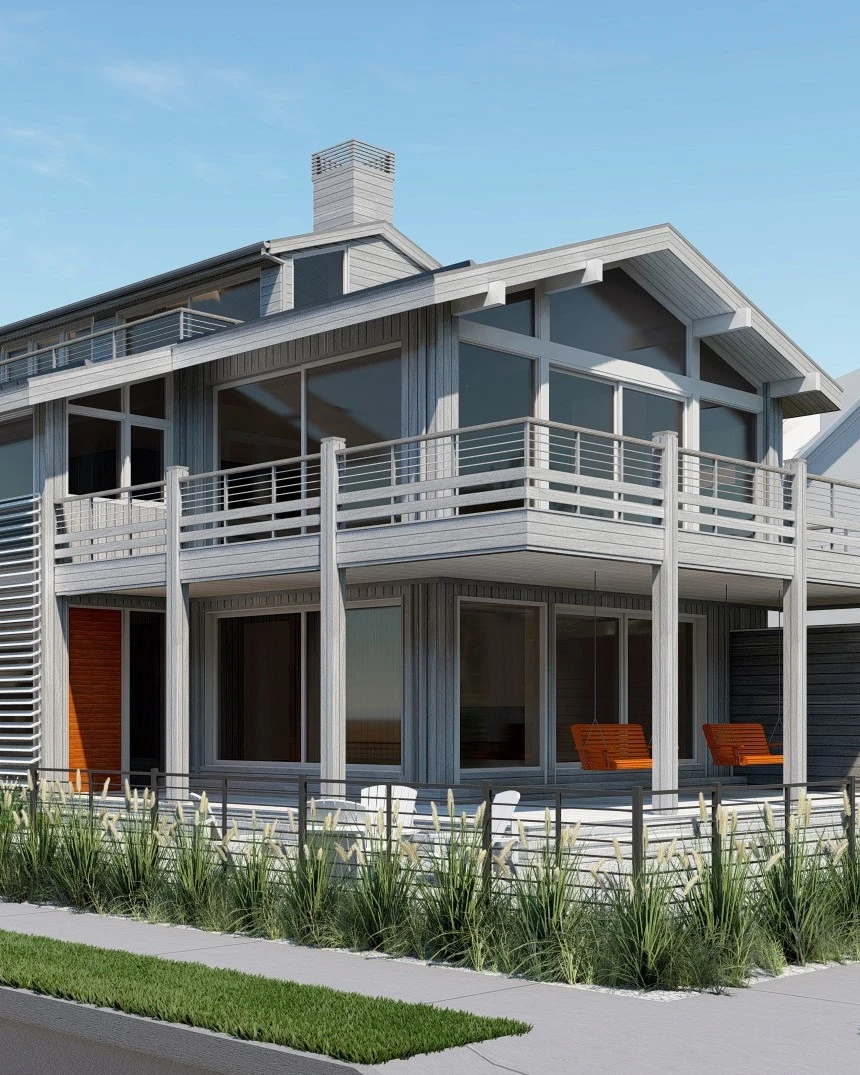 Modern two-story coastal home with corrugated metal siding, extensive glazing, horizontal cable railings, and cantilevered decks.
