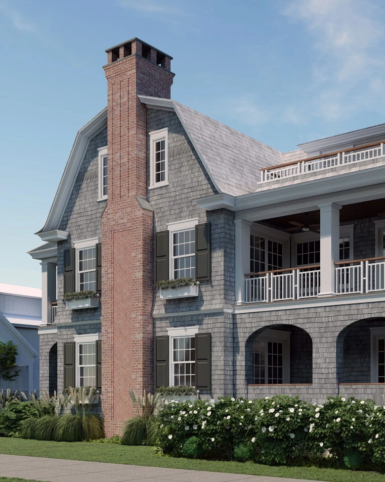 Shingle and brick residential facade with mansard roof, arched openings, and covered porch.